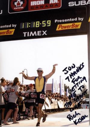 Vancouver Chiropractor at Aquarius Chiropractic 7 Rich K crossing the Ironman Penticton finish line. Dr. Gerrard at Aquarius Chiropractic treats Ironman Triathletes.