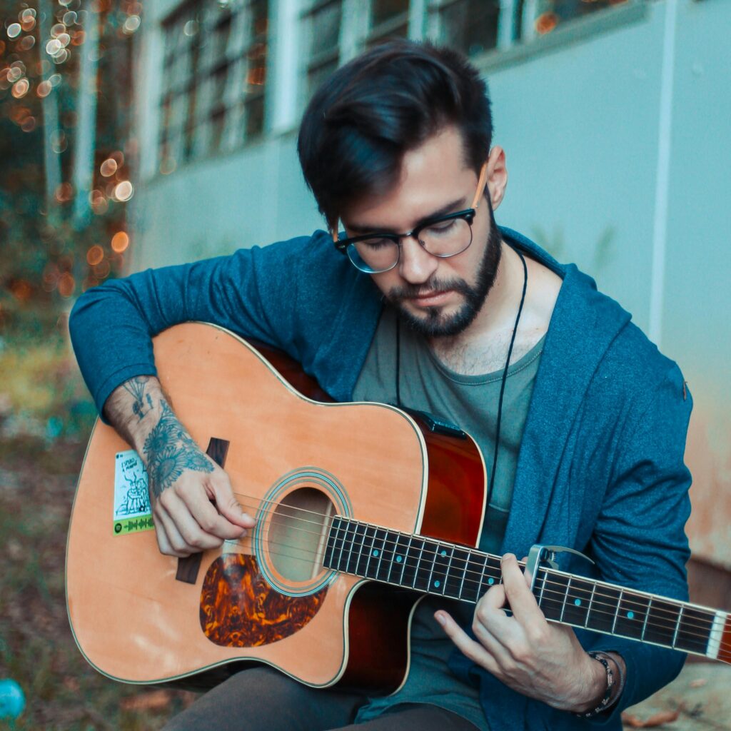 🎵 Harmonize Your Health: How Chiropractic Care Enhances Musician Biomechanics 3 string instrument. guitar. musician injuries, musician chiropractor