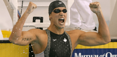 Brent Hayden, Canadian Olympic swimmer, in the pool celebrating after a strong finishing time at the 2012 Summer Olympics.